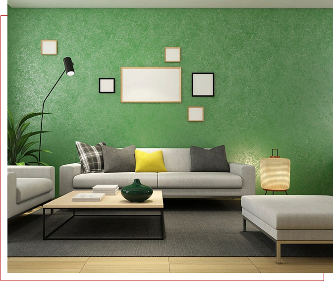 A living room with green walls and white furniture.